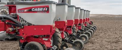 //assets.cnhindustrial.com/caseih/NAFTA/NAFTAASSETS/Products/Planting-and-Seeding/Early-Riser-Planter/1215-Rigid-Mounted/1215_Planter_0513_AMSM_A-1105_mr.jpg?width=410&height=171