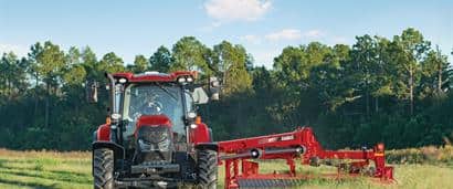 //assets.cnhindustrial.com/caseih/NAFTA/NAFTAASSETS/Products/Mowers-and-Conditioners/Rotary-Disc-Mower-Conditioners/DC133/Maxxum-145-and-DC133_0286_10-17.jpg?width=410&height=171