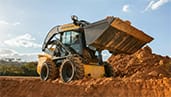 300-series-skid-steer-loaders-heavy-soil